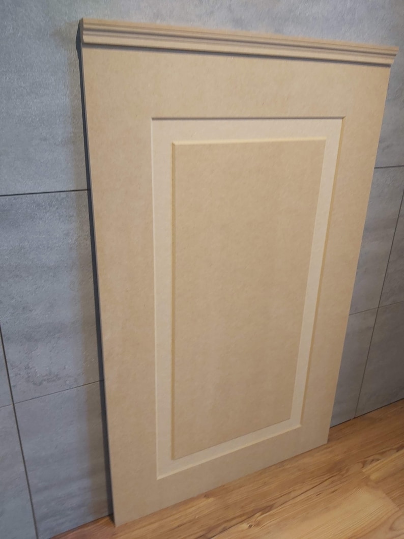 May include: A light beige wood panel with a raised, rectangular design. The panel has a simple, elegant look and is perfect for adding a touch of sophistication to any room.