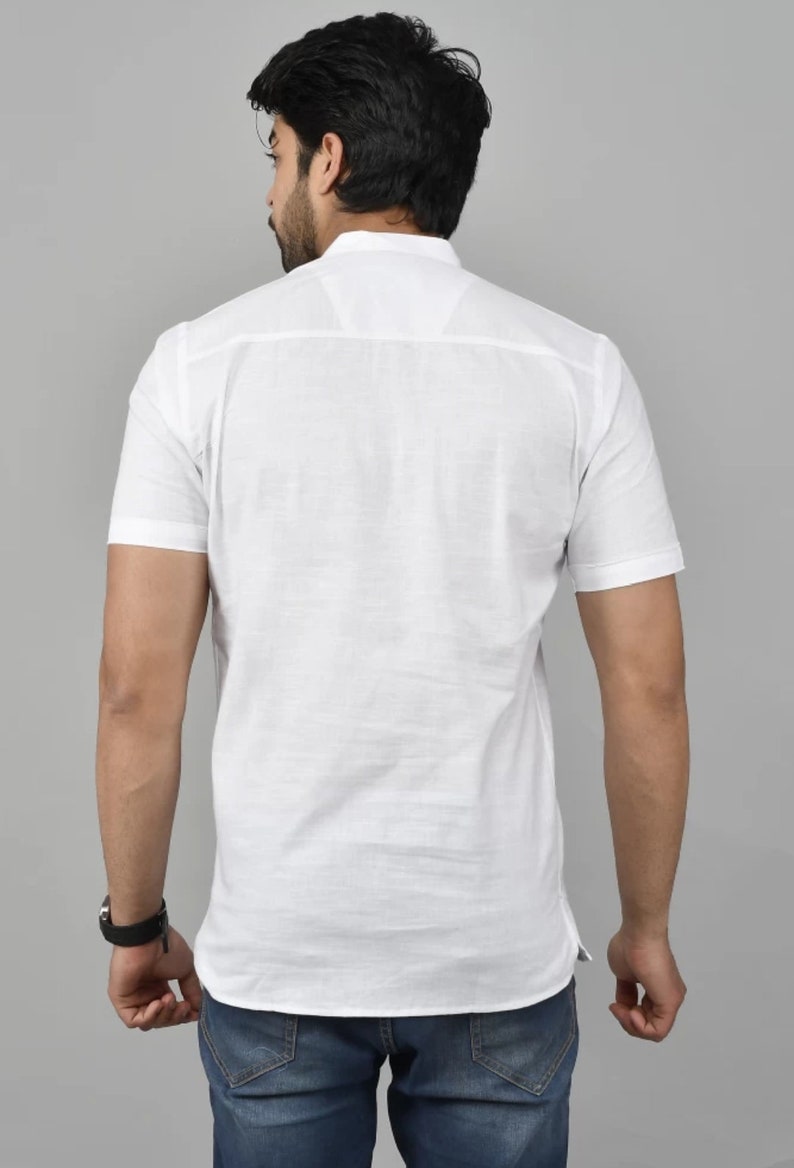 May include: A white short-sleeved button-down shirt with a mandarin collar.