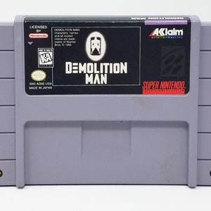 Demolition Man - na konsolę SNES - działający kartridż - region NTSC lub PAL - fantastyczny stan