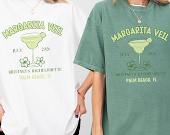 May include: Two white and green t-shirts with the text "Margarita Veil" and a margarita glass graphic. The text also includes "July 2026", "Brittney's Bachelorette", and "Palm Beach, FL".