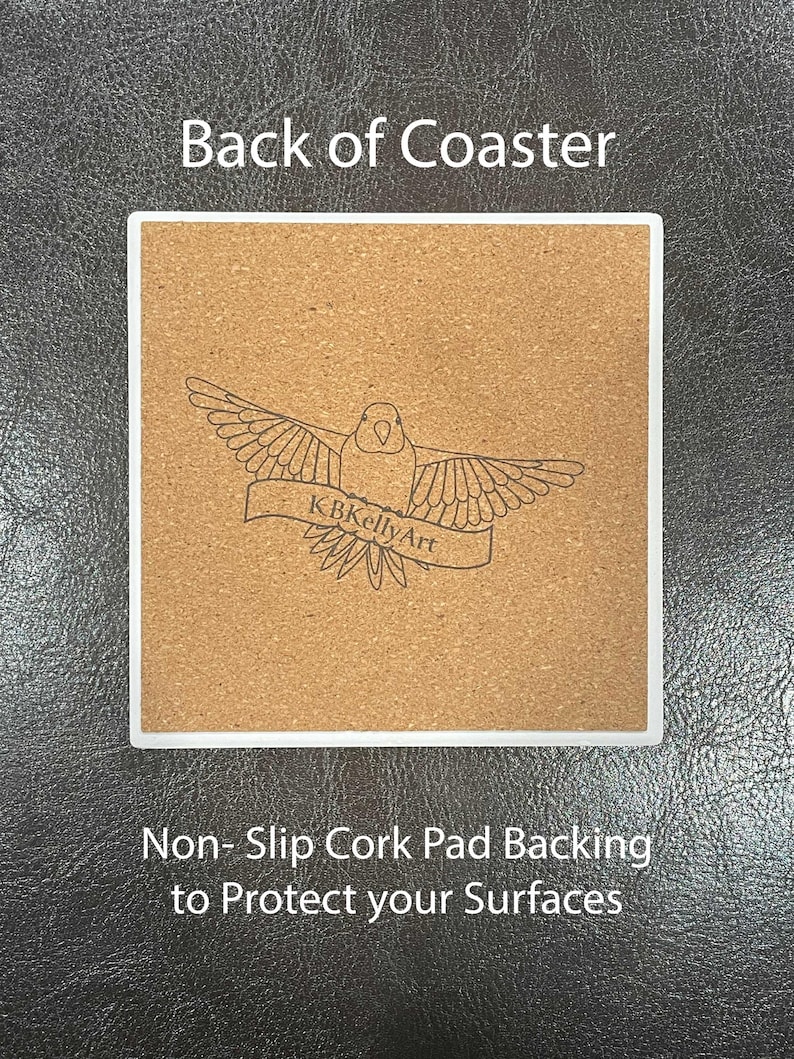 May include: Square coaster with a white border and a cork backing. The cork backing features a bird design with the text "KBKellyArt" on a banner. The text "Back of Coaster" is at the top, and "Non-Slip Cork Pad Backing to Protect your Surfaces" is at the bottom.