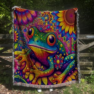 May include: A colorful psychedelic throw blanket featuring a vibrant green frog with rainbow accents surrounded by flowers and swirls.