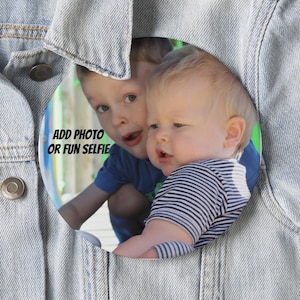 May include: Two young boys, one with a striped shirt and the other with a blue shirt, are smiling and looking at the camera. The text "ADD PHOTO OR FUN SELFIE" is written on the image.