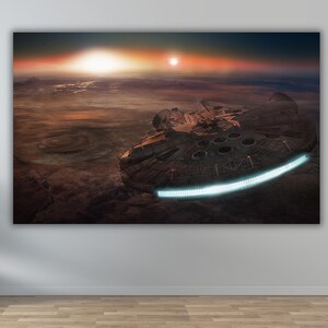 May include: A spaceship, possibly the Millennium Falcon, flies over a red and orange planet with two suns in the sky. The spaceship is casting a shadow on the planet's surface.