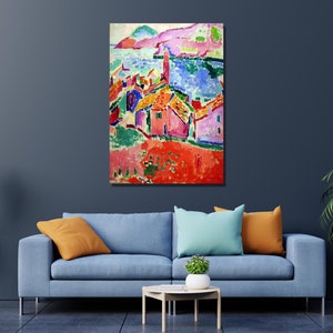 May include: A colorful abstract painting of a seaside village with houses in shades of pink, red, yellow, and blue. The painting features a bright blue sea and a green hillside in the background.