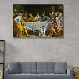 May include: A rectangular wall art print depicting a parody of The Last Supper featuring Star Wars characters. The scene shows figures in robes seated at a long table, with one figure holding a glowing blue lightsaber and an R2-D2 droid in the centre.