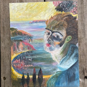 May include: A painting depicting a person wearing a blue shirt, set against a landscape backdrop. The person has a dark face with a white stripe across their eyes and red lips. The landscape is a seascape with a yellow sky and a blue sea. There are trees in the foreground.