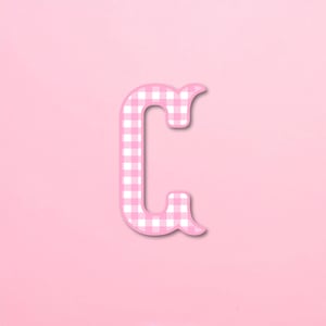 May include: A capital letter C with a light pink and white gingham checkered pattern. The letter features a thick, rounded font style with a subtle white outline around the edges, creating a clean and distinct appearance against the background.