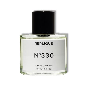 May include: A clear glass bottle of Replique Fragrances No. 330 Eau de Parfum. The bottle is 3.4 fl oz (100 ml).