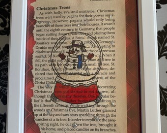 Arte de la página del libro de Navidad del muñeco de nieve del globo de nieve enmarcado