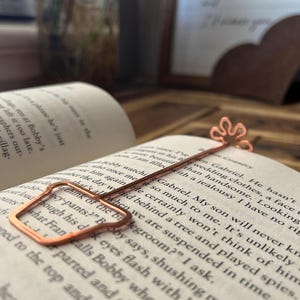 May include: A set of three ceramic mugs with a speckled, matte finish. The mugs are in shades of cream, light brown, and dark brown. Each mug has a simple, minimalist design, perfect for coffee or tea.