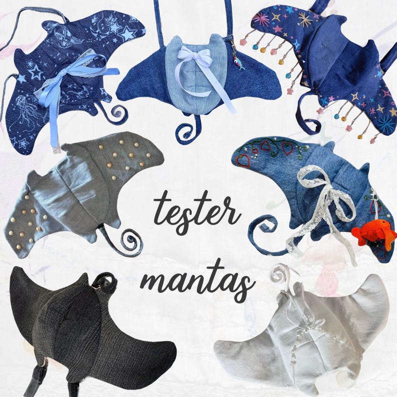May include: A collection of eight handmade denim manta ray plushies. The plushies are in various shades of blue and grey, with some featuring embellishments like sequins, beads, and ribbons. The plushies are arranged in a circle on a white background, with the text "tester mantas" written in black below them.