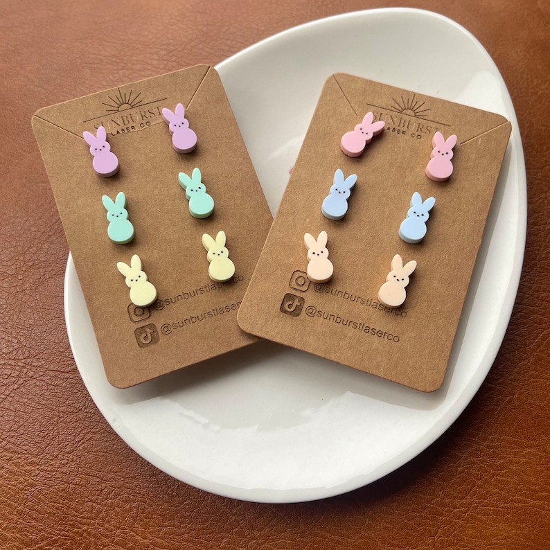 Two sets of three pairs of bunny shaped earrings