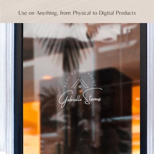 May include: A white logo on a frosted glass storefront window. The logo features a house icon with the text "Real Estate Agent" and "Gabrielle Stevens".