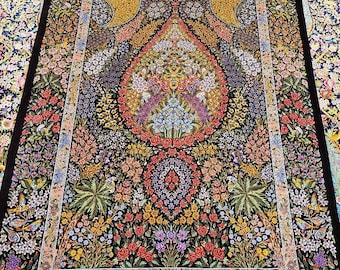 May include: A Persian rug with a black background and intricate floral patterns in shades of red, yellow, blue, and green. The rug features a central medallion with a teardrop shape and a border with a repeating floral design.