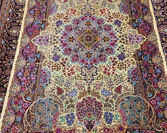 May include: A traditional Persian rug with a cream background and intricate floral patterns in shades of pink, blue, and purple. The rug has a border of dark blue and burgundy with a fringe.