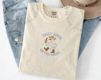 Camiseta "Ganso tonto suelto" / Camiseta divertida de ganso vaquero / Camiseta de ganso bebedor de cerveza / Regalo divertido de animales / Camiseta con estampado de ganso del oeste
