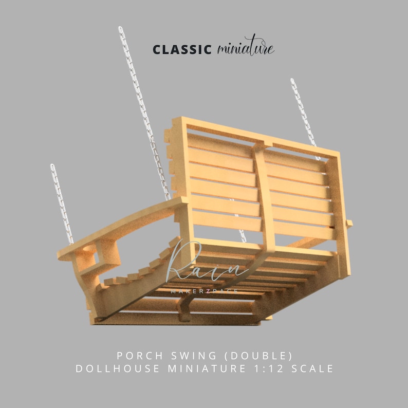 May include: A light-colored wooden porch swing with a slatted seat and back, suspended by white chains. The miniature swing is labeled "CLASSIC miniature" and "PORCH SWING (DOUBLE) DOLLHOUSE MINIATURE 1:12 SCALE".