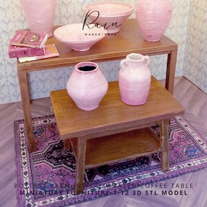 May include: A miniature dollhouse furniture set with a two-tiered wooden coffee table, a rug, and pink pottery. The set includes vases, bowls, and books. The rug is purple with a detailed pattern. The text "Rain MAKERZ PACE" is visible.