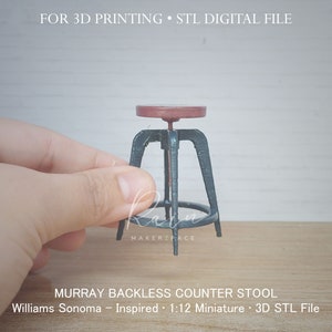 May include: A miniature backless counter stool with a dark metal frame and a round, reddish-brown seat. The stool is labeled "MURRAY BACKLESS COUNTER STOOL" and is a 1:12 miniature, inspired by Williams Sonoma. The image also includes the text "FOR 3D PRINTING" and "STL DIGITAL FILE."