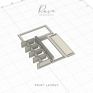 May include: A light beige print layout of a storage organizer, featuring multiple compartments and a rectangular frame. The text "Rain MAKERZPACE" is in a script font at the top, and "PRINT LAYOUT" is at the bottom.