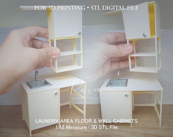 May include: A white 1:12 scale miniature laundry area floor and wall cabinet set for 3D printing. The set includes a sink, countertop, and two cabinets with shelves. The cabinets are designed to be mounted on a wall. The STL digital file is for 3D printing.