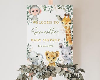 May include: A rectangular welcome sign for a baby shower featuring watercolor illustrations of a monkey, giraffe, lion cub, elephant, and rhino surrounded by green eucalyptus leaves. The text reads Welcome to Samantha's Baby Shower 08-24-2024.