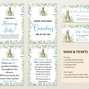May include: A set of printable baby shower game signs featuring Peter Rabbit illustrations. The signs include "How Big is Mommy's Belly?", "Guess How Many Candies Are in the Jar", "Pacifier Hunt", and "My Water Broke".