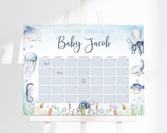 Puede incluir: Un juego de baby shower azul y blanco con un calendario para que los invitados adivinen la fecha de llegada de Baby Jacob. El calendario está decorado con criaturas marinas como un delfín, una medusa, un pulpo, un caballito de mar, una ballena y un pez globo.