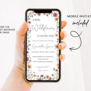May include: A mobile phone screen displaying a baby shower invitation with a floral design. The invitation reads "a little wildflower is on the way!" and includes the name "Samantha Green", the date "Saturday, March 28th at 2pm", the location "Smith's Residence no Party Drive. Trinity, New York", and the RSVP information "RSVP to Sabrina at 123.456.7890". The invitation also includes the text "registered at Target & Amazon".