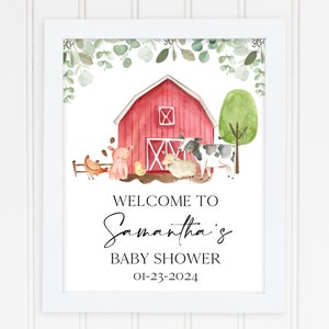 May include: A red barn with a white door and windows, surrounded by green foliage and farm animals. The text "Welcome to Samantha's Baby Shower 01-23-2024" is printed below the barn.