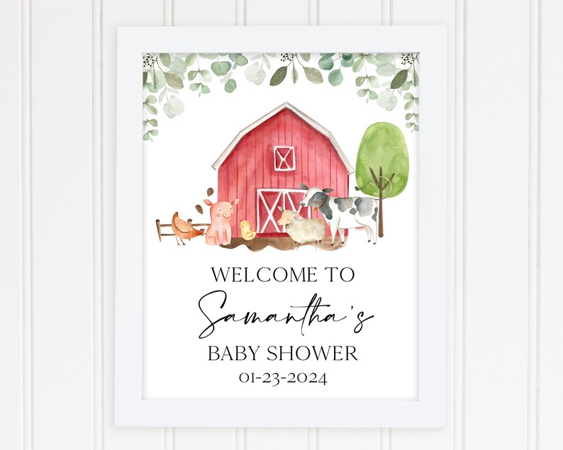 May include: A red barn with a white door and windows, surrounded by green foliage and farm animals. The text "Welcome to Samantha's Baby Shower 01-23-2024" is printed below the barn.