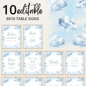 Op de afbeelding: Tien bewerkbare 8x10 tafelsignalen met een lichtblauw aquarel wolkontwerp. De borden bevatten tekst als "Babies are sweet", "Books & Gifts" en "Drinks". De borden zijn omlijst met een licht houten rand.