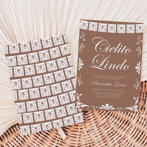 May include: Two brown rectangular cards with white decorative paper cut-out patterns. One card features the text Cielito Lindo, baby shower details for Samantha Green, and date and time information. The other card displays a repeating pattern of white floral motifs.