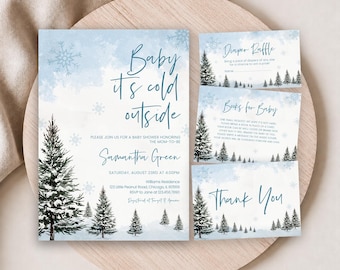 May include: A set of baby shower stationery featuring a winter theme with light blue watercolor washes, dark green pine trees, and snowflakes. The text reads Baby it's cold outside, Diaper Raffle, Books for Baby, and Thank You in blue script.