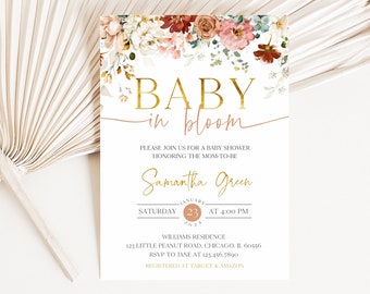 Op de afbeelding: Babyborrel uitnodiging met bloemaccenten. De uitnodiging toont de tekst "BABY in bloom" in gouden letters, samen met details van het evenement, inclusief datum, tijd en locatie. Het ontwerp bevat een bloemenrand.