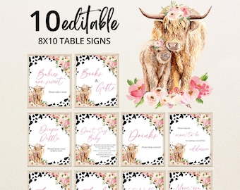 May include: Ten editable 8x10 table signs featuring a Highland cow illustration with floral details. The signs display text including "Babies are sweet," "Books & Gifts," and "Diaper Raffle." The signs are designed for an event.