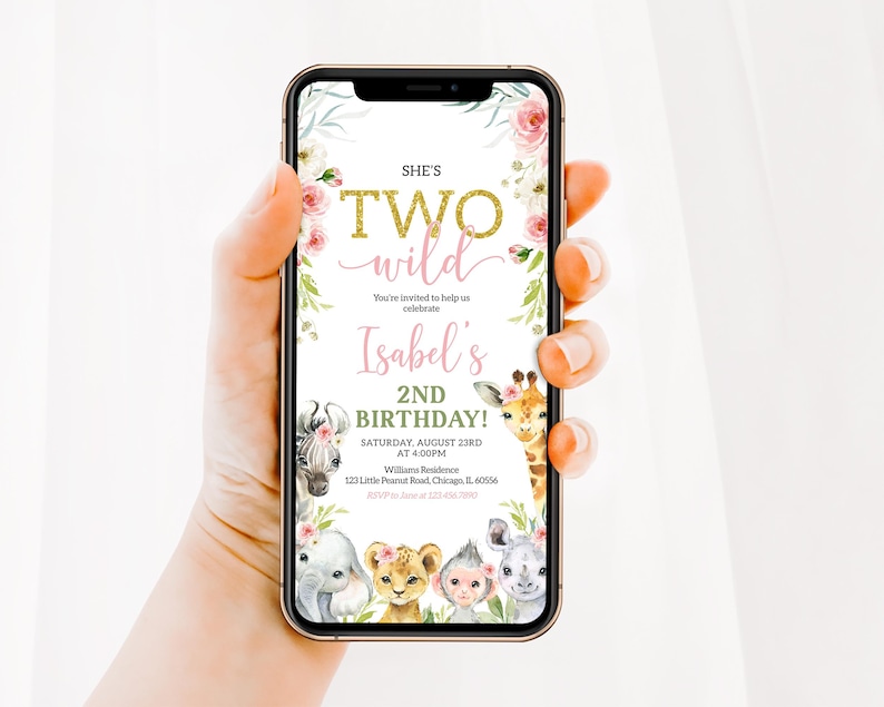 May include: A smartphone displays a birthday invitation with the text "She's Two Wild" in gold glitter font. The invitation features floral accents, animal illustrations, and details for Isabel's 2nd birthday.