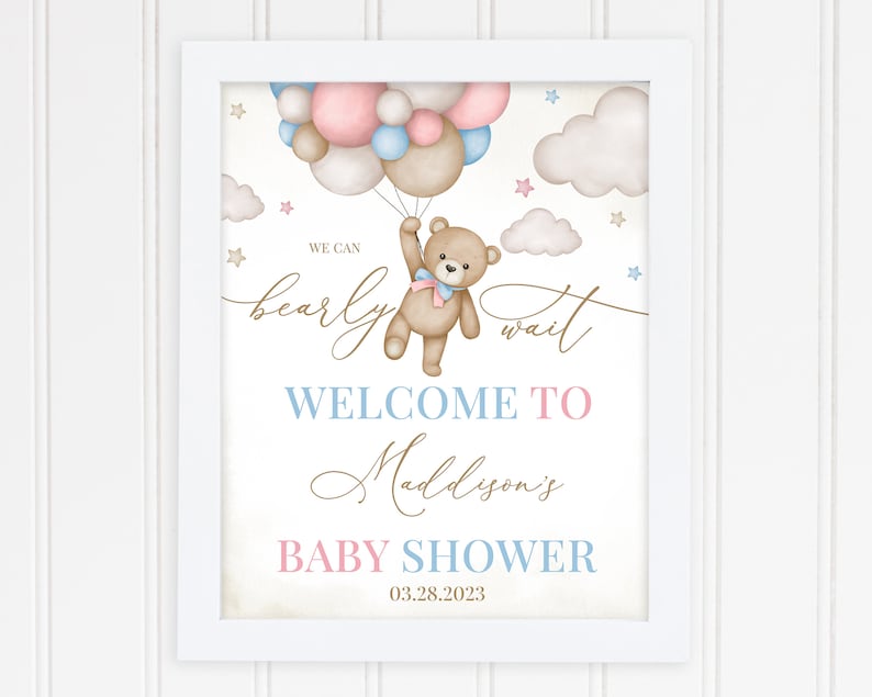 May include: A baby shower sign with a teddy bear holding balloons. The sign says "We can bearly wait" and "Welcome to Maddison's Baby Shower 03.28.2023".