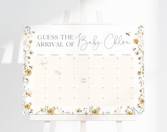 Könnte beinhalten: Ein weißer Kalender mit floralen Rändern und einem hellbraunen Hintergrund. Der Kalender ist für die Monate April und Mai. Der Text "Erraten Sie die Ankunft von Baby Chloe" steht oben auf dem Kalender. Das Fälligkeitstermin ist im Kalender markiert.