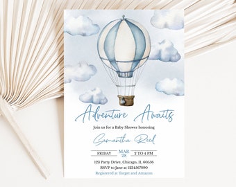 May include: A blue and white hot air balloon with a basket underneath floats in a watercolor sky with white clouds. The text "Adventure Awaits" is written in blue cursive script. The text "Join us for a Baby Shower honoring Samantha Reed" is written in blue cursive script. The text "Friday, March 28, 2 to 4 PM, 123 Party Drive, Chicago, IL 60556, RSVP to Jane at 1234567890, Registered at Target and Amazon" is written in black text.