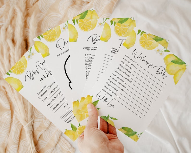 May include: Four lemon-themed baby shower game cards. The cards are white with black text and watercolor illustrations of lemons. The cards include games like "Baby Pred and A", "Whose Baby Pea Will Have", "Draw", and "Wishes for Baby".