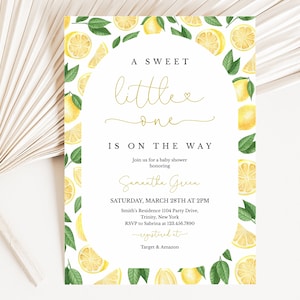 May include: A white baby shower invitation with a lemon theme. The invitation has a yellow and green border of lemons and leaves. The text reads "A Sweet Little One Is On The Way" and includes the date, time, and location of the shower.