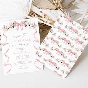 May include: A pink and white baby shower invitation featuring a floral garland and pink ribbon. The text reads "a sweet little girl is on her way!" and includes the date and time of the event. The invitation is for Samantha Green.