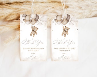 May include: Two brown and beige thank you tags with a teddy bear holding balloons. The text on the tags reads "Thank You for showering baby with love. Love, Maddison."