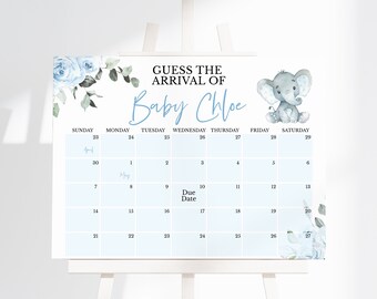 Op de afbeelding: Een wit bord met de titel GUESS THE ARRIVAL OF Baby Chloe, voorzien van een lichtblauw kalenderraster, blauwe bloemillustraties in de hoeken en een grijze olifant. De kalender bevat de tekst April, May en Due Date.