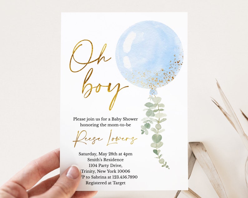 May include: A blue and gold baby shower invitation with a watercolor balloon and eucalyptus leaves. The text reads "Oh boy" and includes details for the event, including the date, time, location, and contact information.