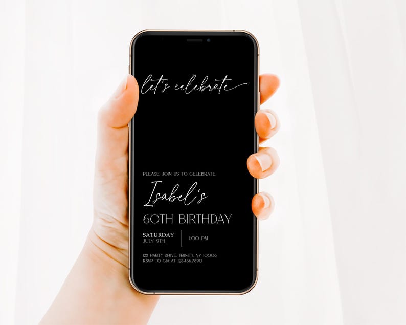May include: A black and white digital invitation displayed on a smartphone screen. The invitation reads "let's celebrate" in a script font, followed by "Please join us to celebrate Isabel's 60th Birthday." The invitation includes the date, time, and address for the event.