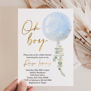 May include: A blue and gold baby shower invitation with a watercolor balloon and eucalyptus leaves. The text reads "Oh boy" in gold script and includes details about the event, including the date, time, location, and RSVP information.