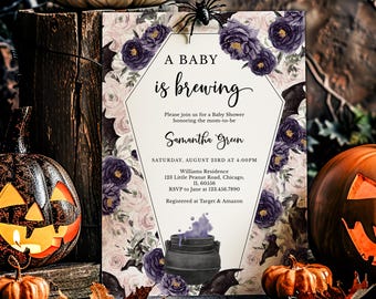 May include: Halloween-themed baby shower invitation with the text "A Baby is Brewing." The invitation features a coffin-shaped design with purple floral accents, bats, and a cauldron. Pumpkins and a spider are also visible.